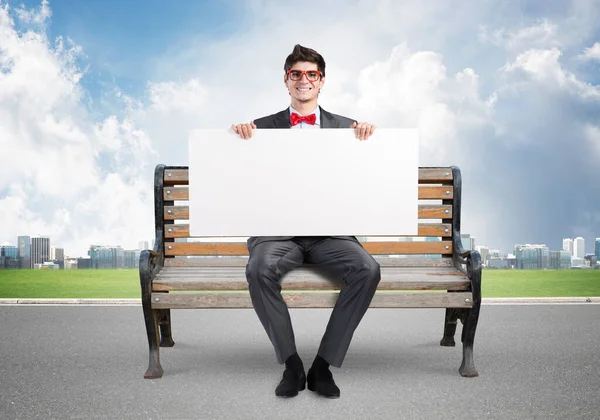 Businessman with an empty banner — Stock Photo, Image