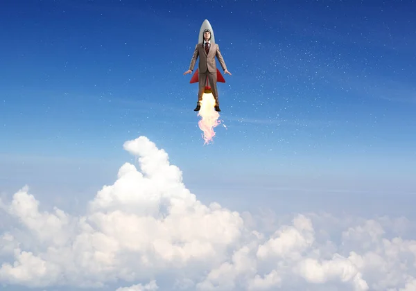 Havacı şapkalı iş adamı roketle uçuyor. — Stok fotoğraf