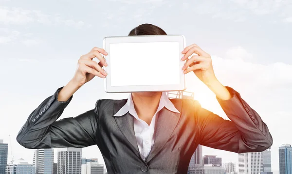 Woman covering her face with tablet computer — Stock Photo, Image