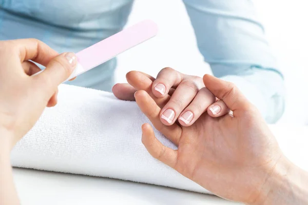 Manicurist using nail file and create clean shape — Stock Photo, Image