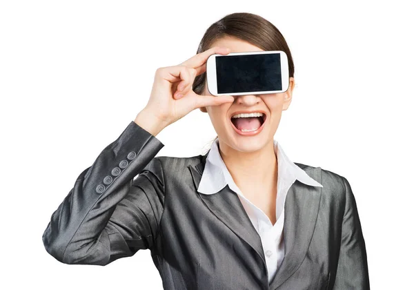 Mujer cubriendo sus ojos con un smartphone — Foto de Stock