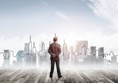 Motivasyon ve ilham konsepti modern şehir manzarası ve onu izleyen iş adamı