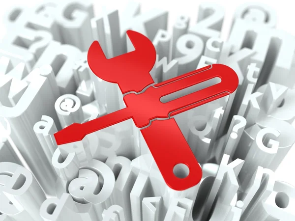 Schraubenschlüssel und Schraubenzieher auf Alphabet-Hintergrund. — Stockfoto