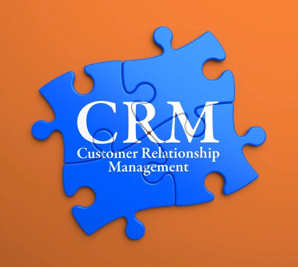 CRM su pezzi di puzzle blu. Concetto aziendale . — Foto Stock
