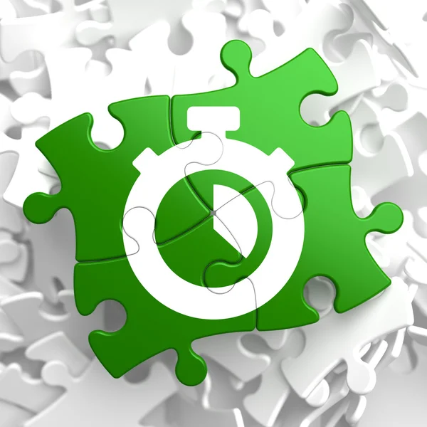 Stopwatch pictogram op groene puzzel. — Stockfoto