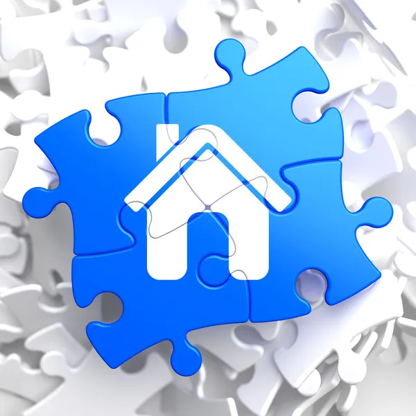 Ikona domova na modré puzzle. — Stock fotografie