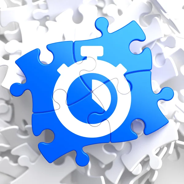 Stopwatch pictogram op blauwe puzzel. — Stockfoto