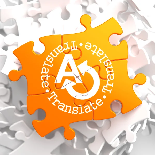 Vertalen concept op Oranje puzzel. — Stockfoto