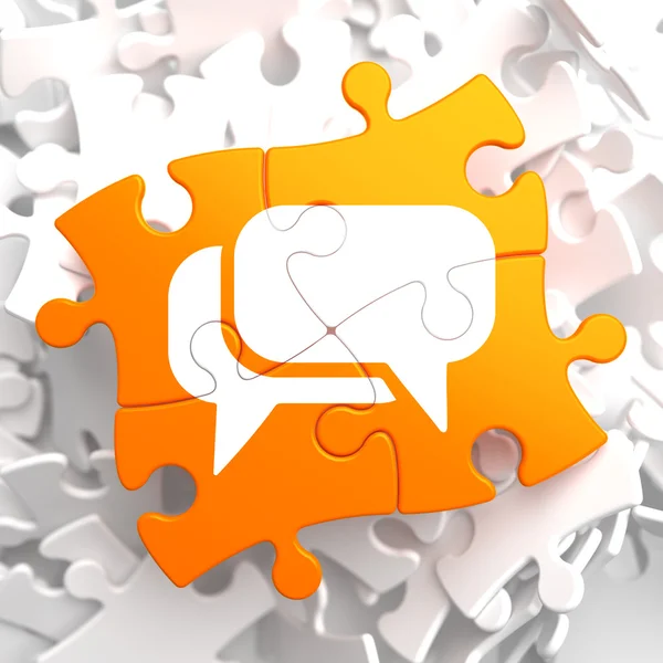 Icône de bulle de discours blanc sur puzzle orange . — Photo