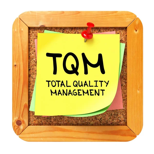 TQM. gula etiketten på bulletin. — Stockfoto