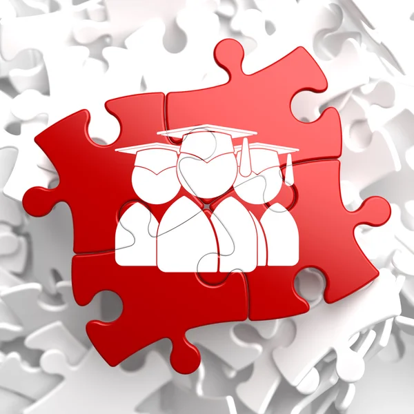 Groep van afgestudeerden pictogram op rode puzzel. — Stockfoto