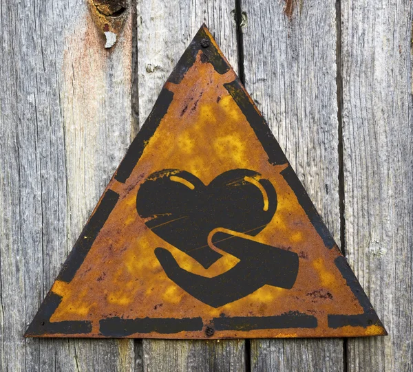 Charity Concept on Weathered Warning Sign. — Stock Photo, Image