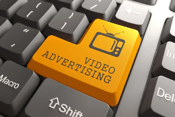 Video Advertising on Orange Keyboard Button. — Stock Photo, Image