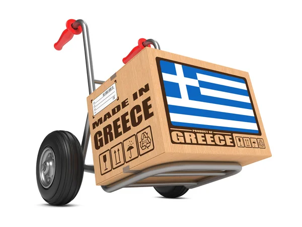 Hecho en Grecia - Caja de cartón en camión de mano . —  Fotos de Stock