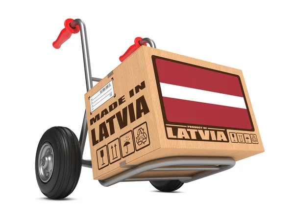 Made in Latvia - Cardboard Box on Hand Truck. — Stock Photo, Image