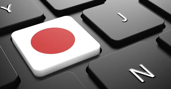 Japan - vlag op knop van zwart toetsenbordJaponsko - vlajky na tlačítko černá klávesnice日本-黑色键盘按钮上的标志. — Stock fotografie