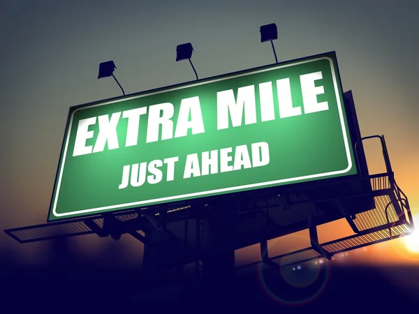 Extra Mile Just Ahead on Green Billboard. — Stock Photo, Image