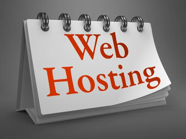 Web hosting - masaüstü takvim üzerinde kırmızı kelime. — Stok fotoğraf