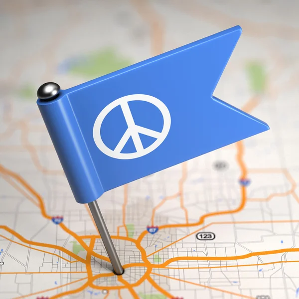 Vredesteken - kleine vlag op de achtergrond van een kaart. — Stockfoto