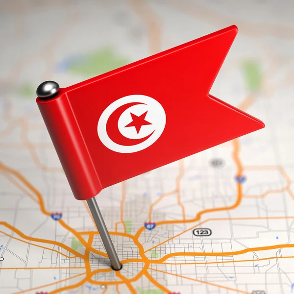 Tunisia Small Flag on a Map Background. — Stock Photo, Image