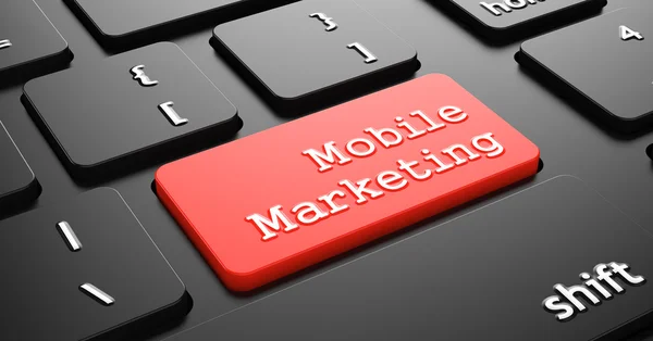 Mobil marknadsföring på röd tangentbord-knappen. — Stockfoto