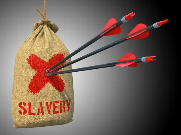 Slaveri - pilar hit i rött märke mål. — Stockfoto