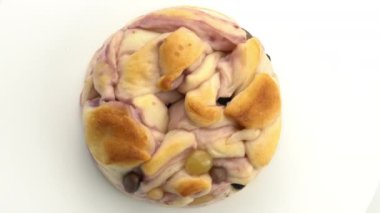 Top view rotation of delicious homemade Purple Sweet Potato Bread on white background.