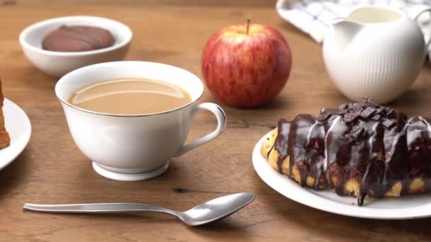 Moving Onthe Breakfast Table Chocolate Covered Croissant Cup Milk Coffee — Stock Video