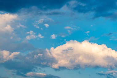 Bright white clouds and blue sky in rainy season. Beautiful blue sky background. Abstract natural sky in tropical rainy season.