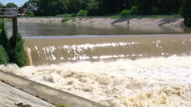 Stream Muddy Water Flowing Rapidly Passing Small Dam Falling Splashing — Stockvideo