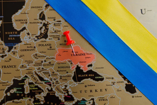 Ukrainian flag on the background of the map of Europe. Concept. Pray for Ukraine.