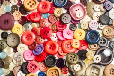 Colored buttons in a heap and in a top view