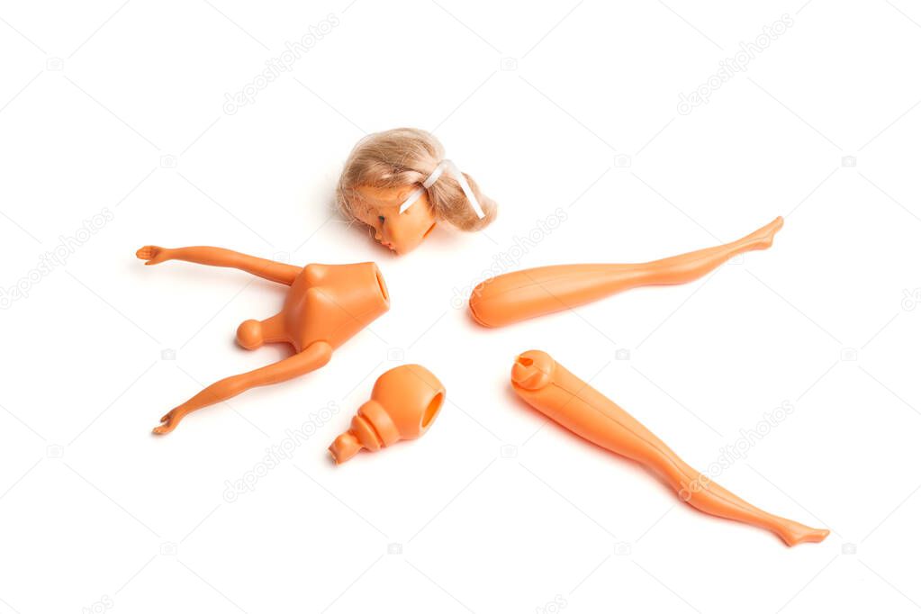 A broken doll on a white background