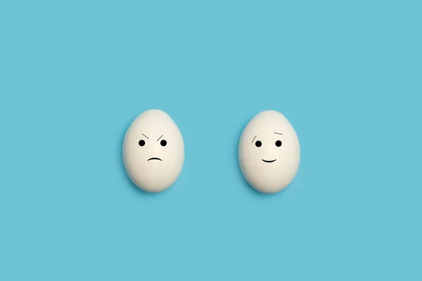 Two Eggs Happy Angry Face Shape Blue Background — Stock Photo, Image