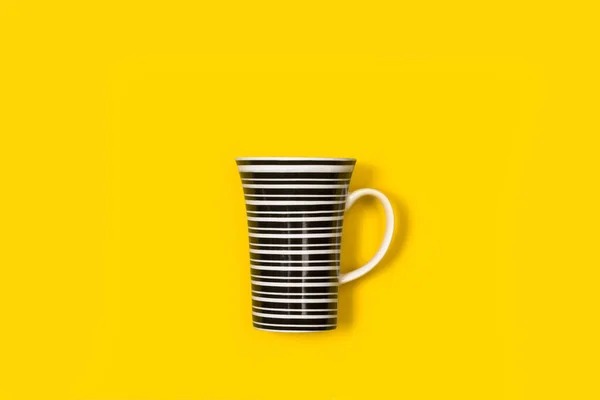 White Black Striped Mug Yellow Background Copy Space —  Fotos de Stock