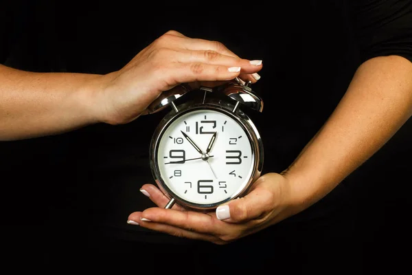 Woman Holding Alarm Clock Her Both Hands —  Fotos de Stock