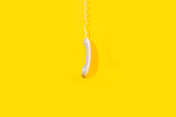 Digital Telephone Receiver Hanging Yellow Background Copy Space — Stok Foto