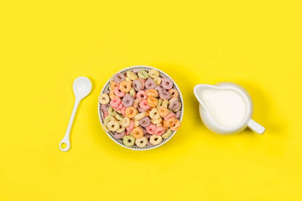 Fruit Flavor Colored Cereals Bowl Milk Jug Yellow Background Top — Stock Photo, Image