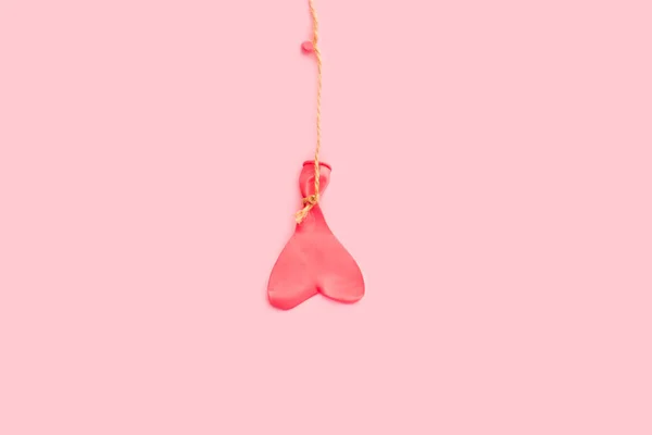 Heart Shape Deflated Pink Balloon Hanging Sisal Thread Pink Background — Stok Foto