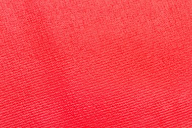 Kırmızı yoga minderinin dokusu yakın planda.