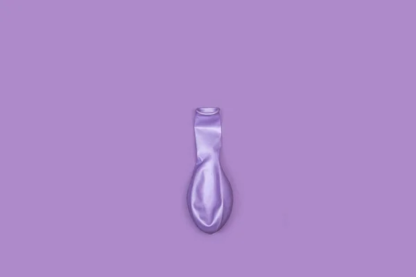 Deflated Purple Balloon Purple Background Copy Space — Photo