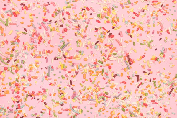 Colored Sweet Sprinkles Pink Background Close View — Foto Stock