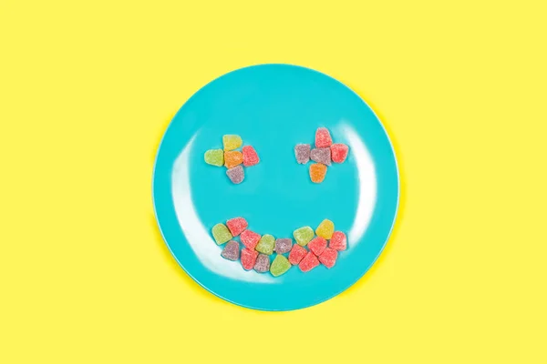 Colored Gummies Blue Plate Yellow Background Copy Space — Photo