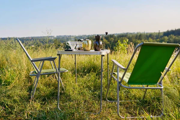 Set of folding furniture for camping, table and chair, summer nature of wild meadow — Stock Photo, Image