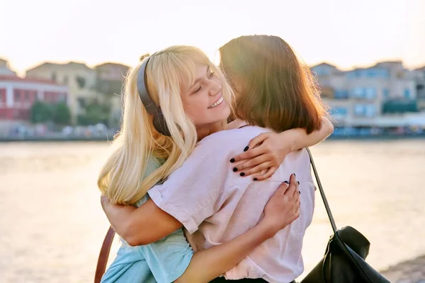 Happy mom and teenage daughter hugging together. — Stock Photo, Image
