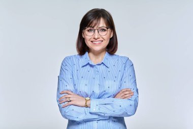 Portrait of a positive confident mature woman looking at the camera