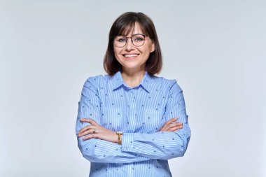Portrait of a positive confident mature woman looking at the camera