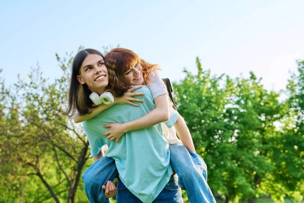 Happy laughing youth, having fun couple of teenagers outdoor — Stock Photo, Image