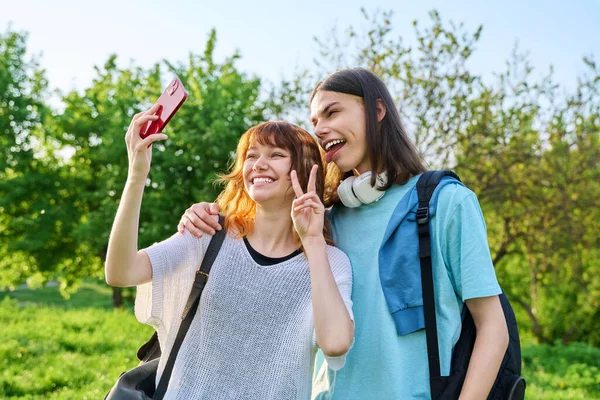 Young Couple Laughing Teenagers Taking Selfie Photo Smartphone Happy Having — Stock Fotó