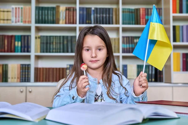 Happy Child Girl Flag Ukraine Candy Stick Looking Camera Sitting — Stock Photo, Image